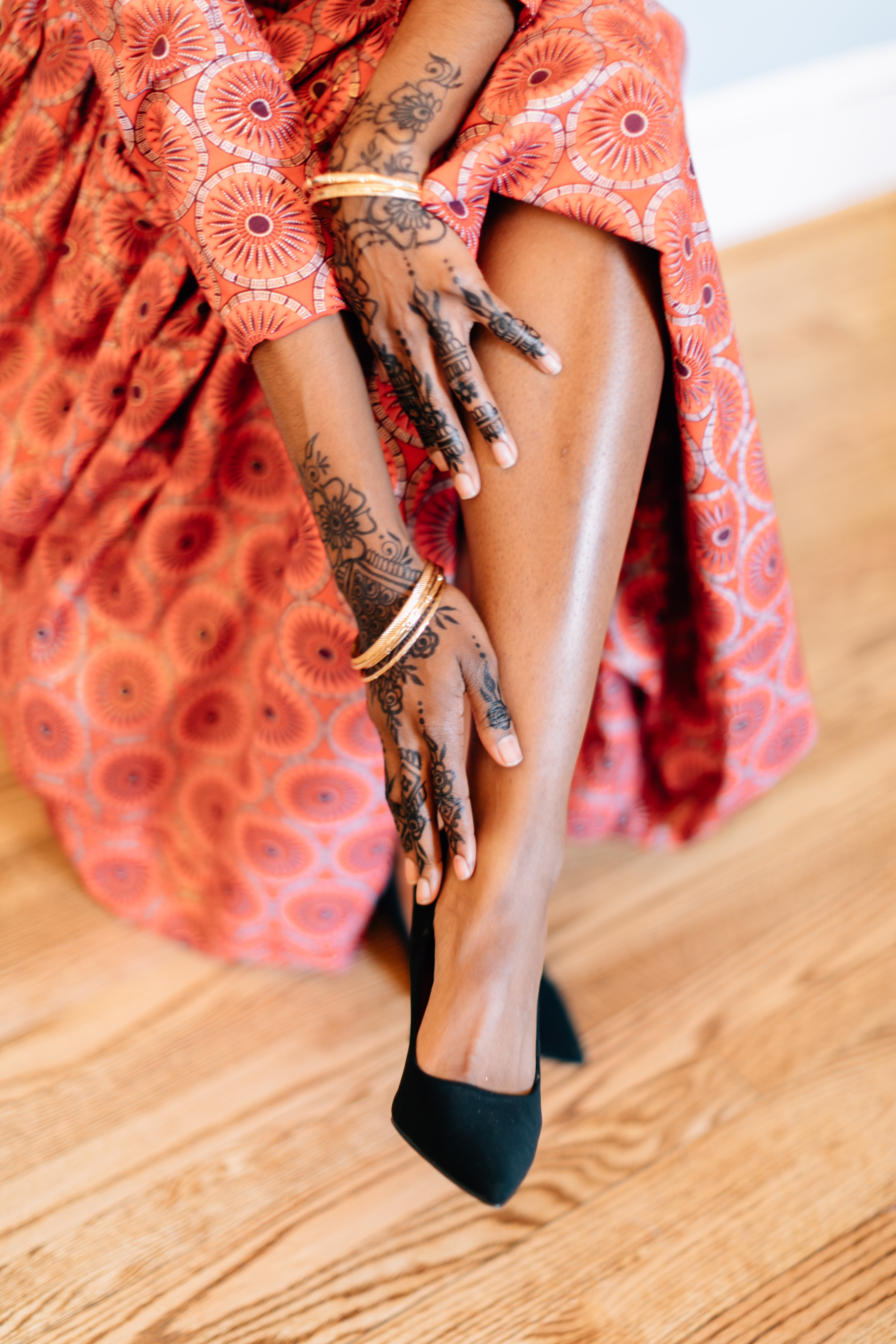 Female hands with black mehndi tattoo and red nail polish. Stock Photo |  Adobe Stock